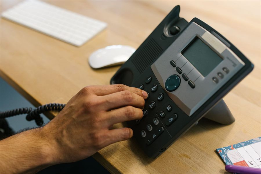 Hand dialing an office desk phone