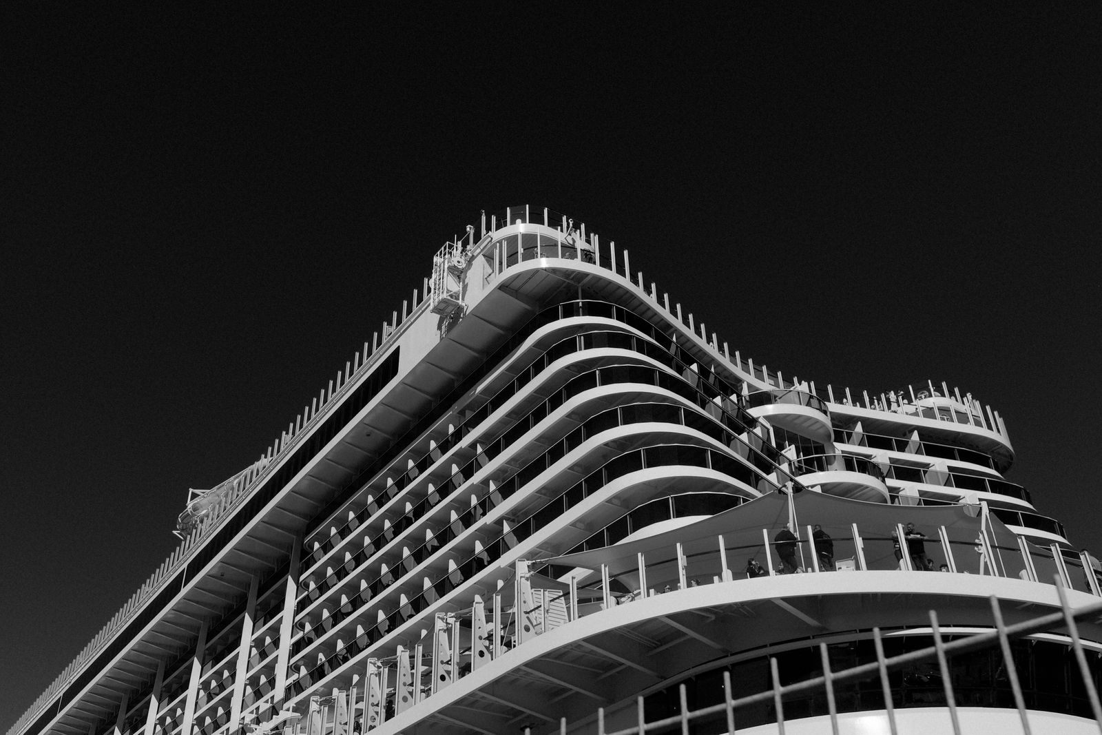 Tiers of balcony cabins on a cruise ship, some of which may be unsold cruise cabins